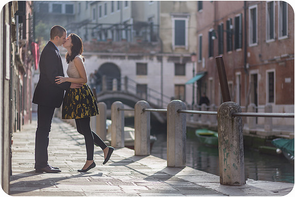 A couple walking through a quiet street in Venice