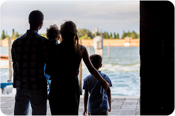 Silhouette of family by Venetian lagoon