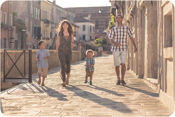 Family walking through authentic Venetian street