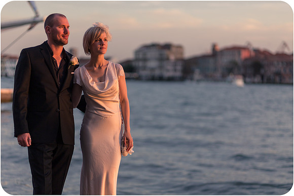 Bride and groom walking through Venice streets