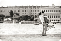 A couple shares a romantic moment after saying yes in Venice.