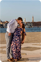 An engagement ring sparkles against the iconic backdrop of Venice.