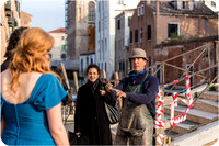 A special moment with a local Venetian passerby, adding character to their love story.