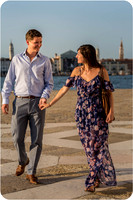 A romantic embrace following a heartfelt proposal on the Grand Canal.