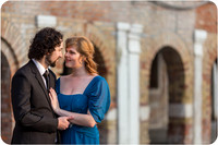The couple looks towards the canal, thinking about their life ahead.