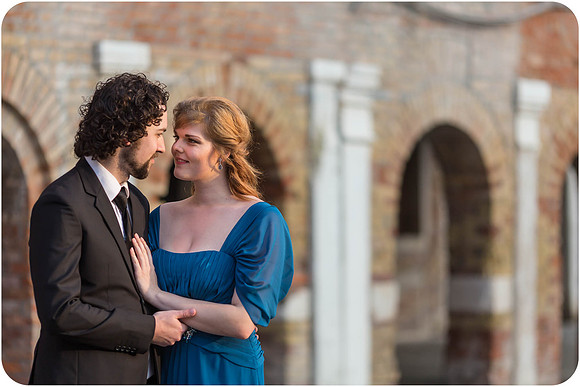 The couple looks towards the canal, thinking about their life ahead.