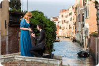 The couple holds hands and smiles after the heartfelt proposal.
