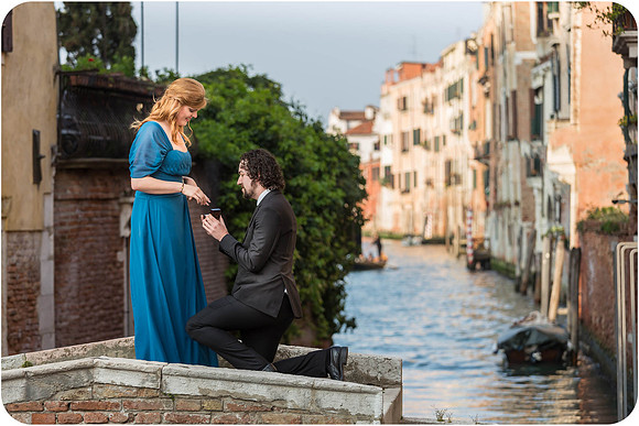 The couple holds hands and smiles after the heartfelt proposal.