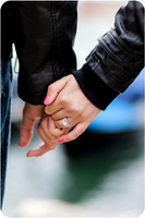 Couple sharing a tender moment near a Venetian bridge.
