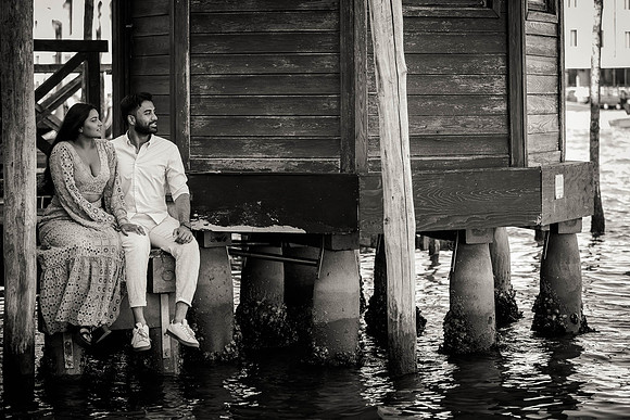 Portrait of couple standing by Venetian columns in Dorsoduro.