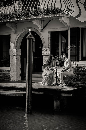 Gondola ride under Venetian bridge in Dorsoduro.