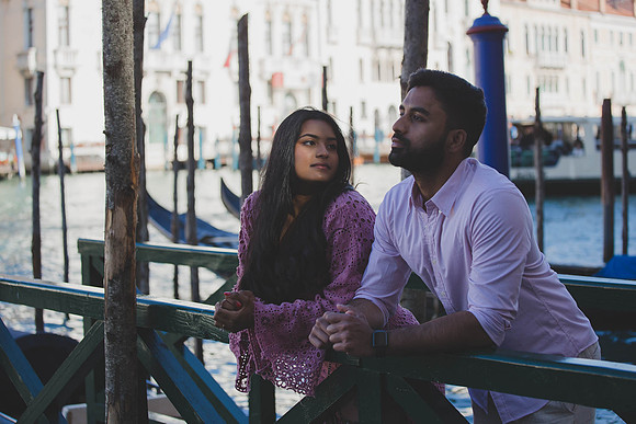 Couple hugging near historic Dorsoduro building, Venice.