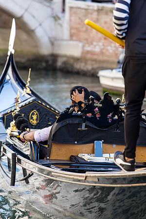 Couple sharing a laugh during gondola ride in Dorsoduro.
