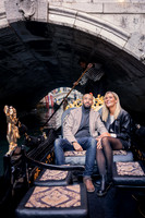A romantic portrait of the couple under a historic bridge, symbolizing their journey together.