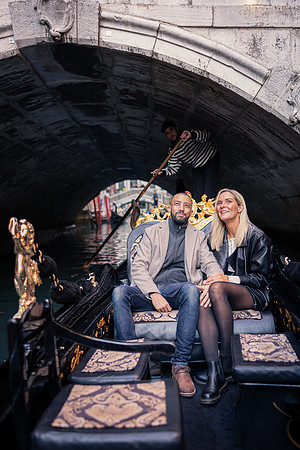 A romantic portrait of the couple under a historic bridge, symbolizing their journey together.