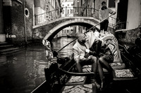 A moment of passion as the couple shares a romantic embrace in a gondola.