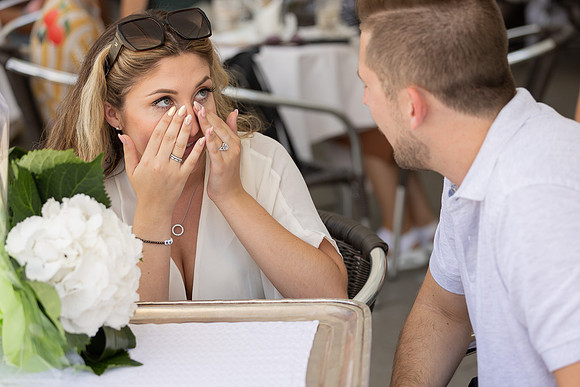 Engaged couple enjoying dessert at Café Florian