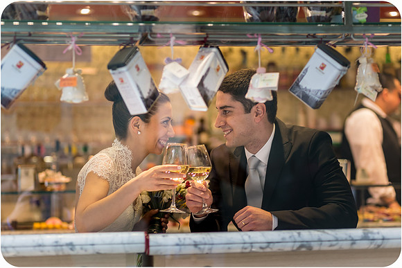 Couple sharing a drink inside Venetian café