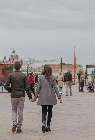 Couple walking in Venice before proposal