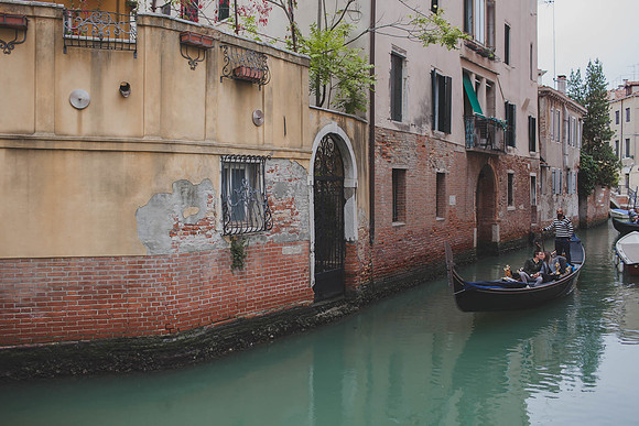Venetian canal with gondola in motion