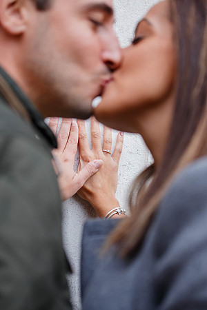 Couple holding hands after proposal in Venice