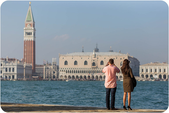 A couple embracing after a heartwarming engagement moment in the floating city.