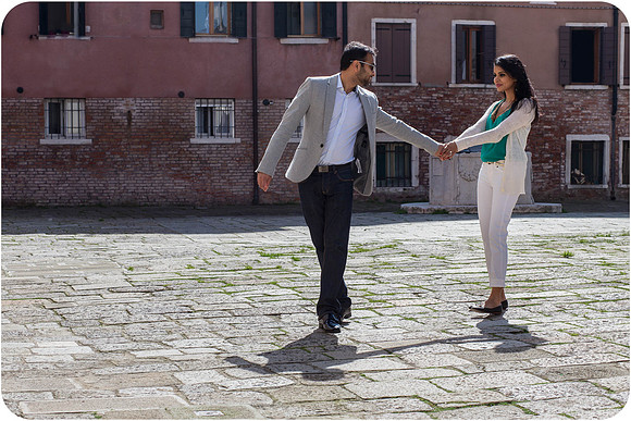 Couple dancing in soft Venetian light