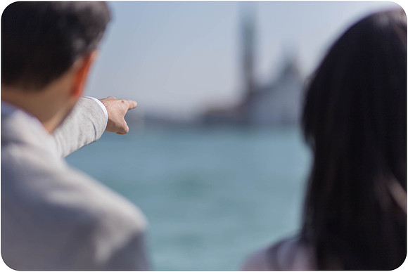 Couple looking at Venice skyline from St. George’s Island