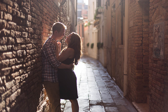 A couple embracing after a heartwarming engagement moment in the floating city.
