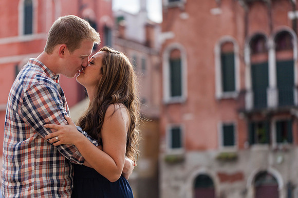 A romantic embrace after the big question is asked in a quiet Venice square.