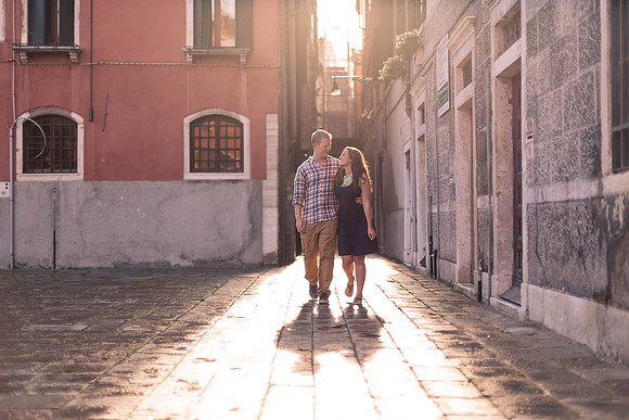 A candid moment of love and joy as a couple gets engaged in Venice.