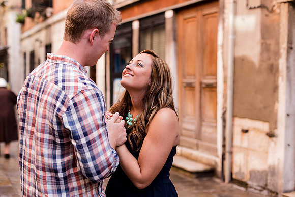 A quiet and intimate engagement moment in a hidden corner of Venice.