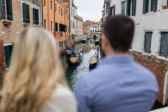 Engaged couple by a historic building in Venice