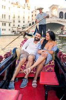 Couple relaxing on gondola ride in Venice's Grand Canal