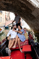 Relaxing on romantic gondola ride through Venice