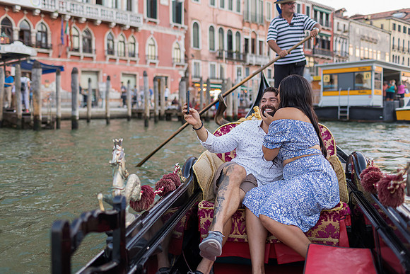 Gondola ride with Rialto Bridge in background