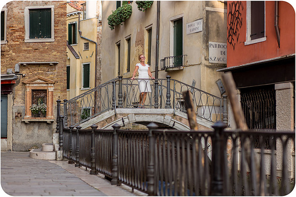 Mother and daughter walking together through the streets of Venice during their family photoshoot.