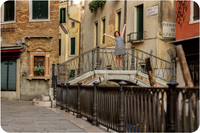 Mother and daughter enjoying breakfast by the canal in Venice during their family photo session.
