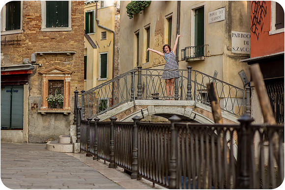 Mother and daughter enjoying breakfast by the canal in Venice during their family photo session.