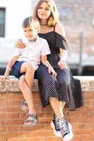 Couple sitting on a wall in Venice.