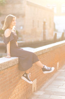 girl on a stone ledge in Venice during a family portrait session