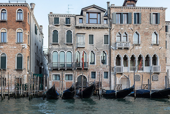Family enjoying views from a gondola in Venice.