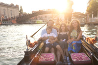 Family with sunset backdrop in Venice.