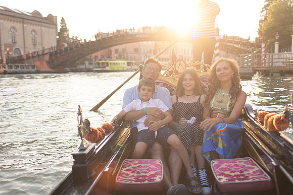 Family with sunset backdrop in Venice.