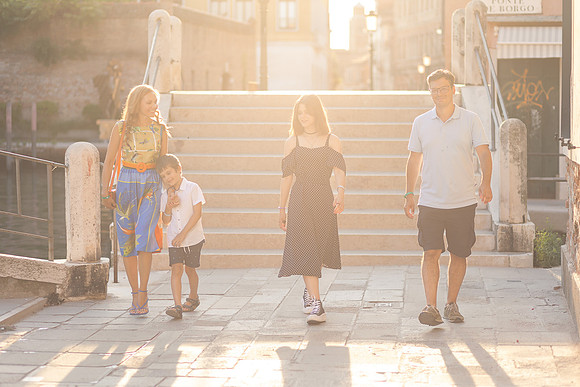 Family smiling   in Venice.