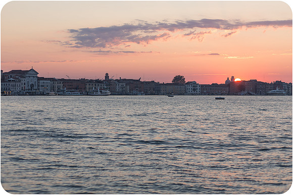 Bride looking out at the Venetian Lagoon at dawn