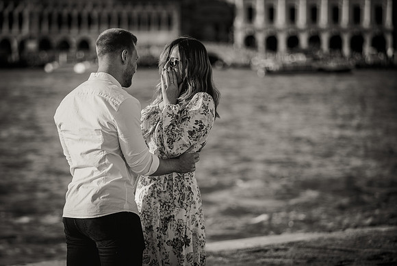 Couple standing together after engagement in Venice