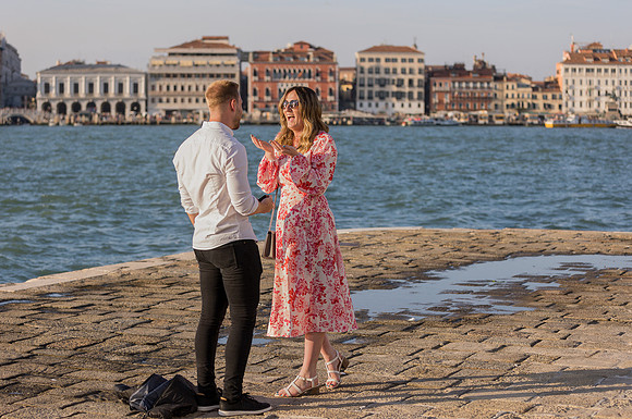 Woman reacting with joy after proposal in Venice