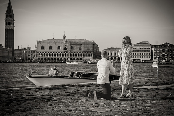 Black and white image of a surprise proposal in Venice