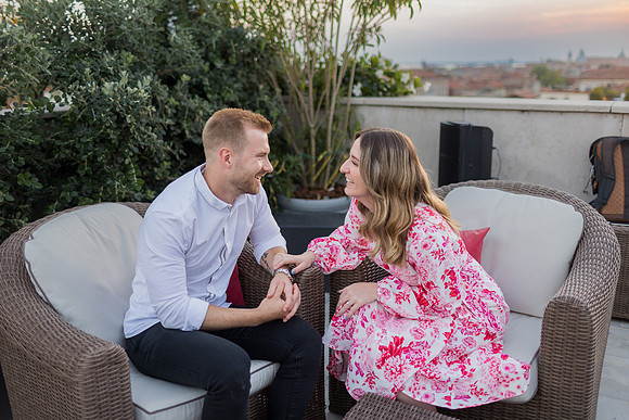 Engaged couple enjoying rooftop view in Venice